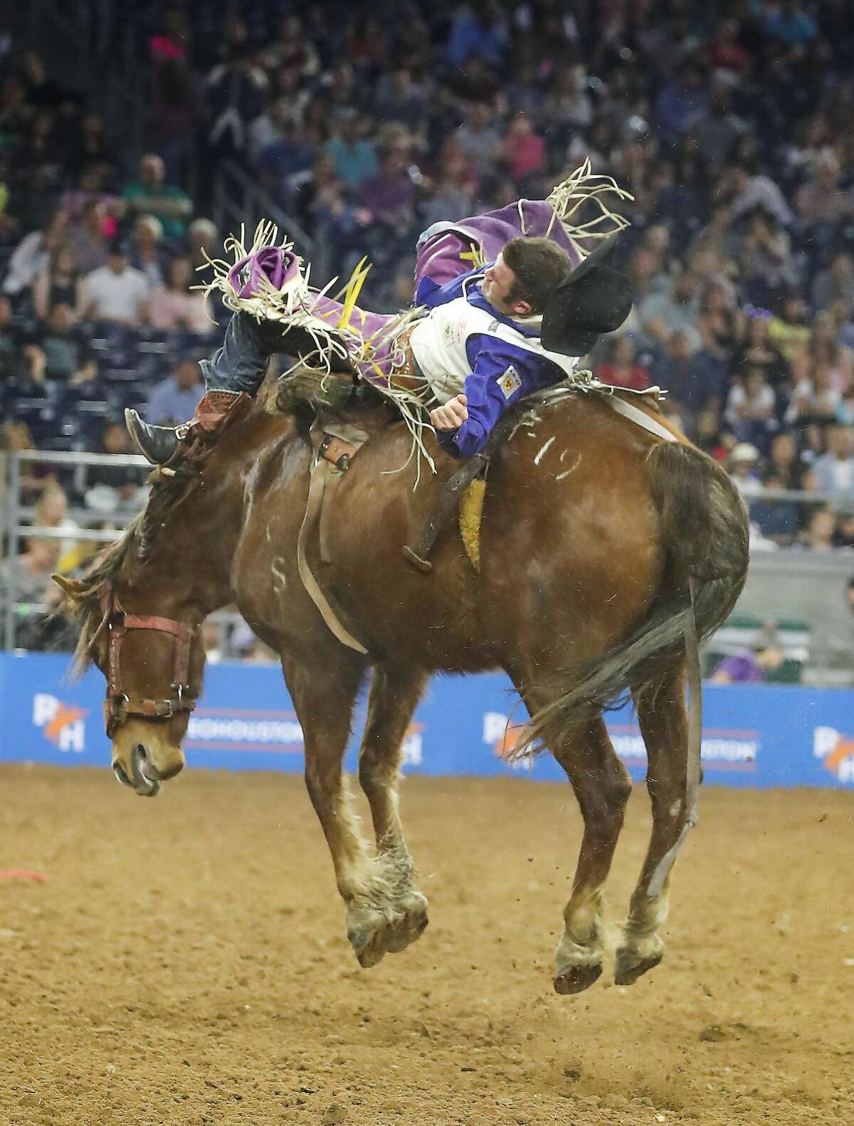 Kaycee Feild loses his hat as he rides Tootsie Roll during Super Series II Round 3 Bareback Riding action at Rodeo Houston Sunday, March 4, 2018, in Houston. ( Steve Gonzales / Houston Chronicle )