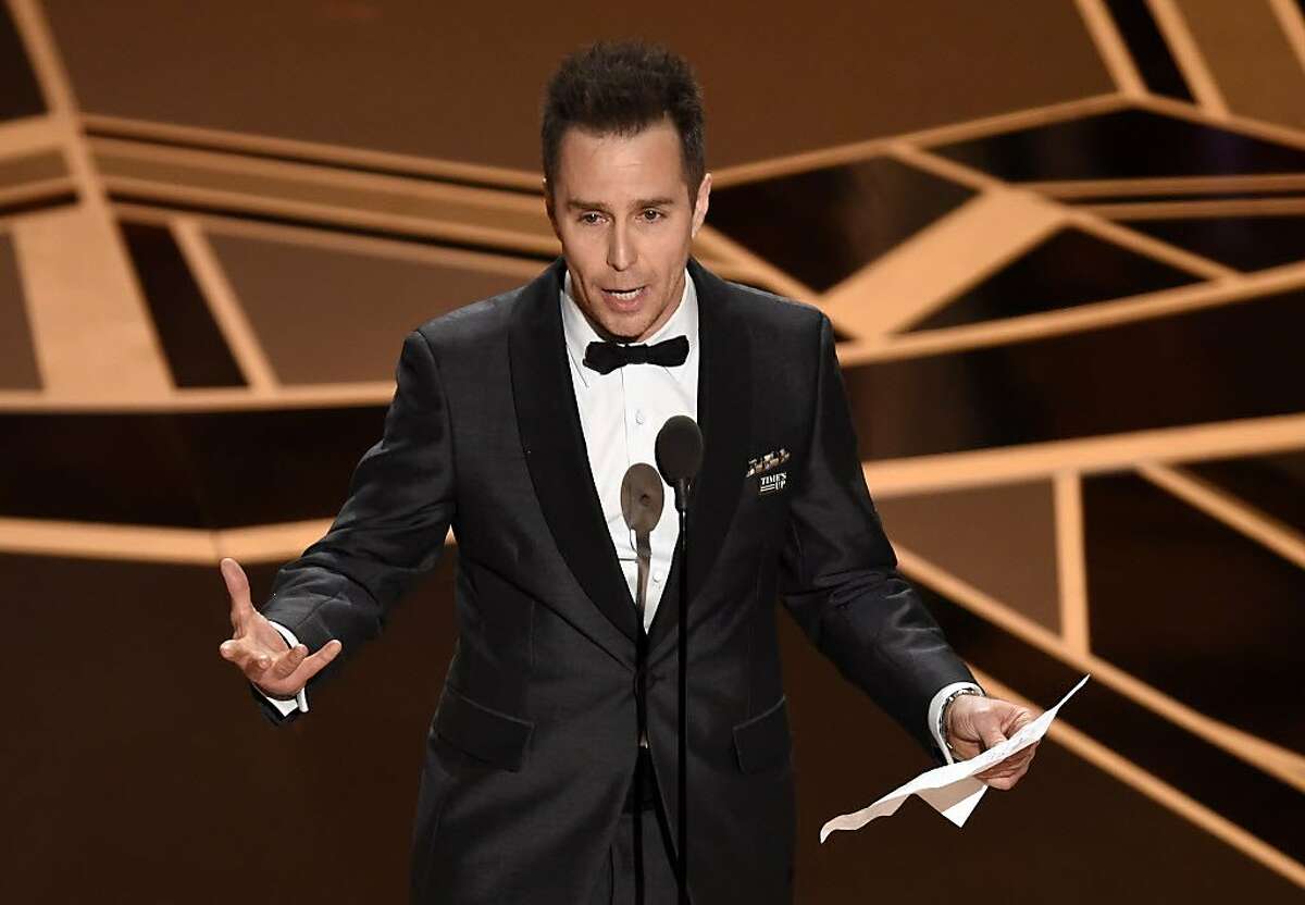 Sam Rockwell accepts the award for best performance by an actor in a supporting role for "Three Billboards Outside Ebbing, Missouri" at the Oscars on Sunday, March 4, 2018, at the Dolby Theatre in Los Angeles. (Photo by Chris Pizzello/Invision/AP)