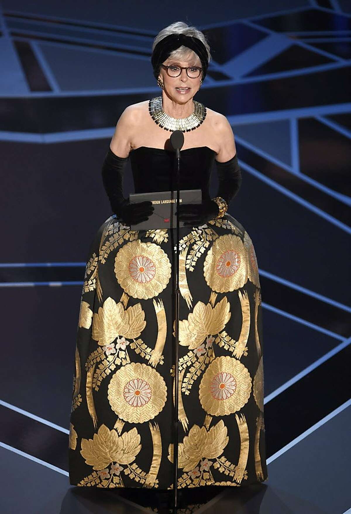Rita Moreno presents the award for best foreign language film at the Oscars on Sunday, March 4, 2018, at the Dolby Theatre in Los Angeles. (Photo by Chris Pizzello/Invision/AP)