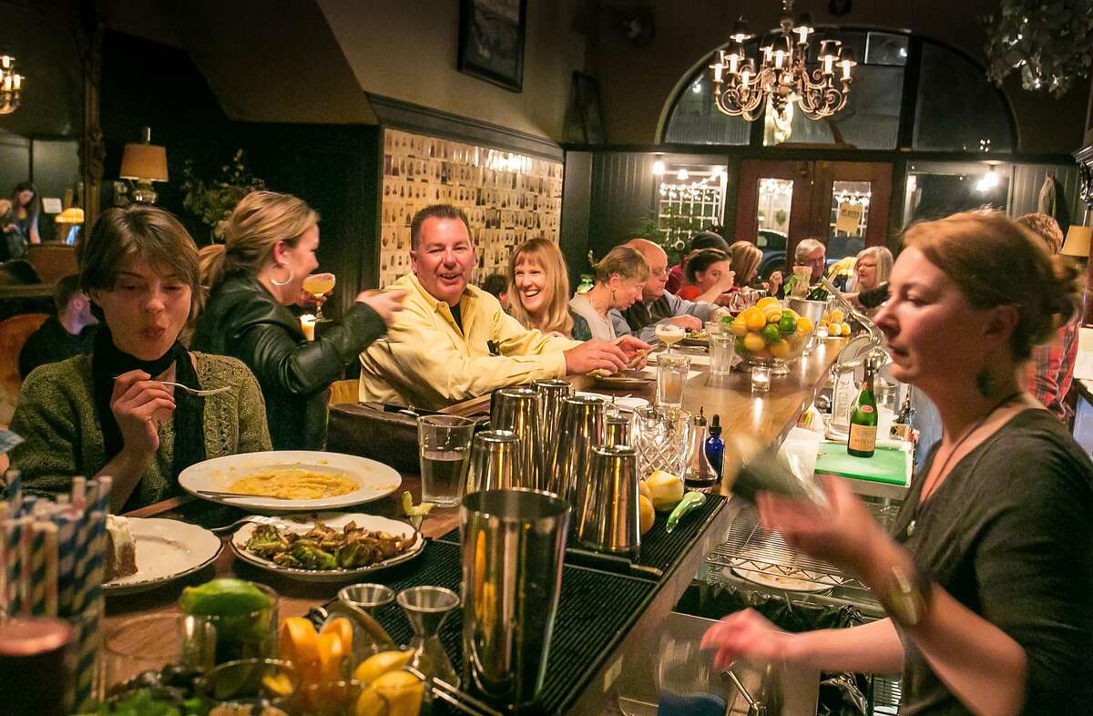 People have dinner at the bar at the Bull Valley Roadhouse in Port Costa, Calif., on Saturday, February 2nd, 2013.
