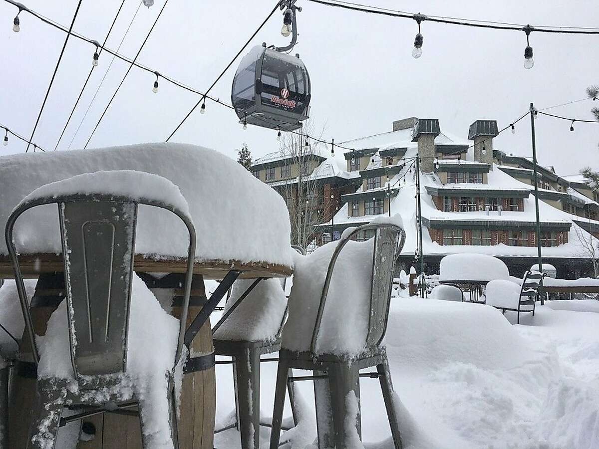 File - In this March 2, 2018, file photo provided by the Heavenly Mountain Resort, fresh snow covers most of a table and chairs in South Lake Tahoe, Calif. Welcome drifts of fresh snow awaited California's water managers on their late-winter survey of the vital Sierra Nevada snowpack Monday, March 5, 2018, after a massive winter storm slowed the state's plunge back into drought. The storm piled up to 8 feet of new snow in the mountains from late last week through the weekend, forcing Department of Water Resources officials to postpone the measurement for a few days. (Heavenly Mountain Resort via AP, File)