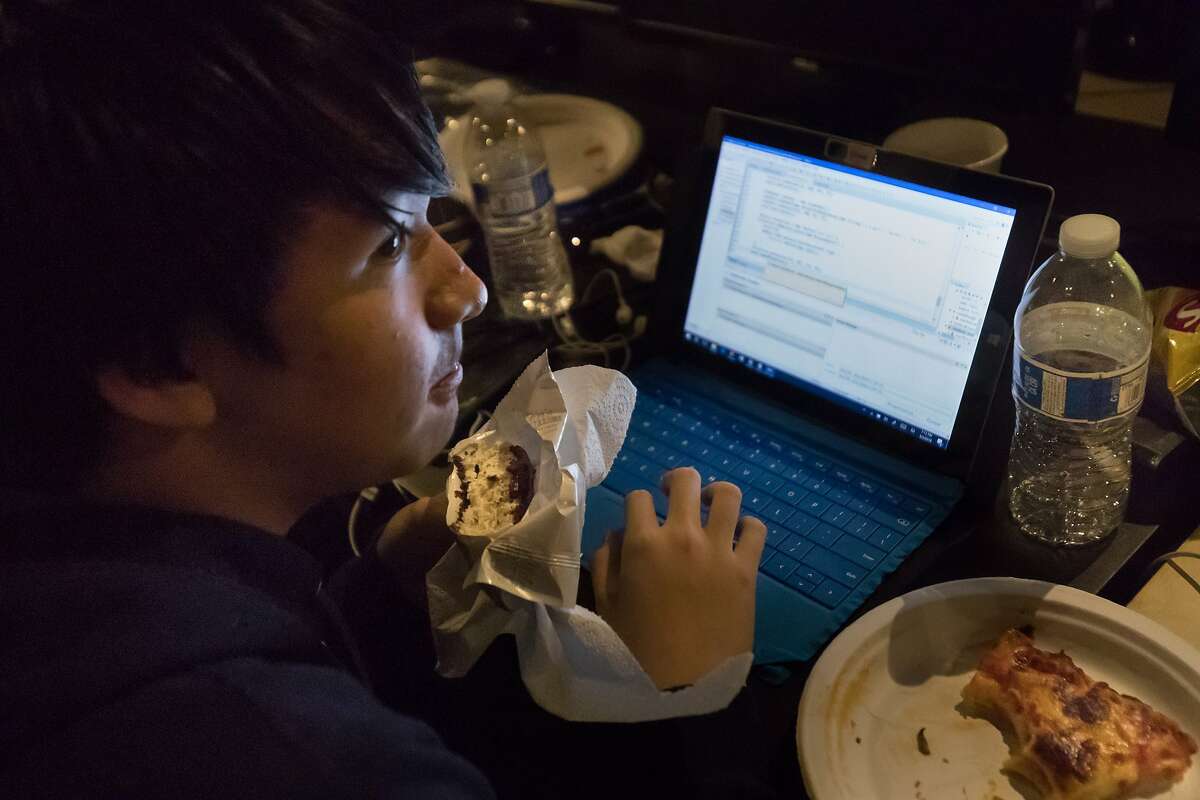 Khanh Hoang, 16, eats an ice cream sandwich during San Francisco'?s first hackathon for high schoolers on Saturday, March 3, 2018 in San Francisco, Calif.