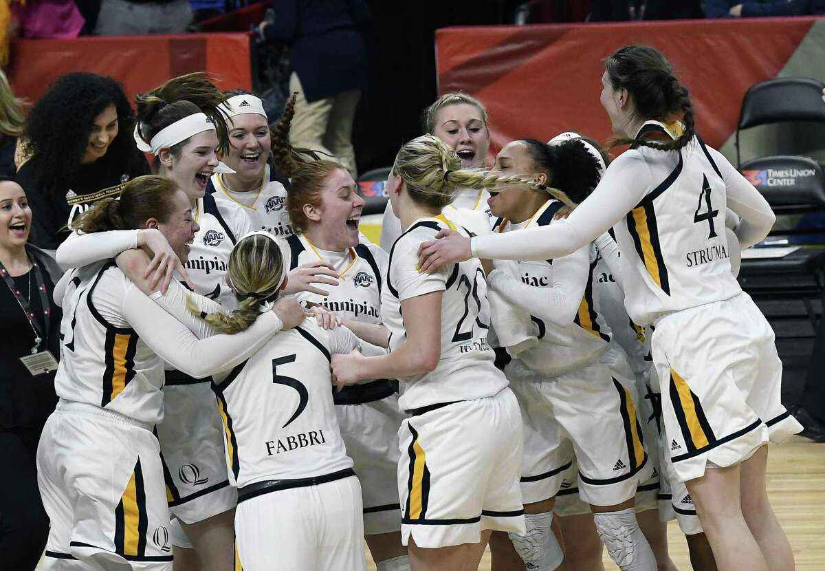 Quinnipiac players celebrate their win over Marist in the MAAC championship game Monday in Albany, N.Y.