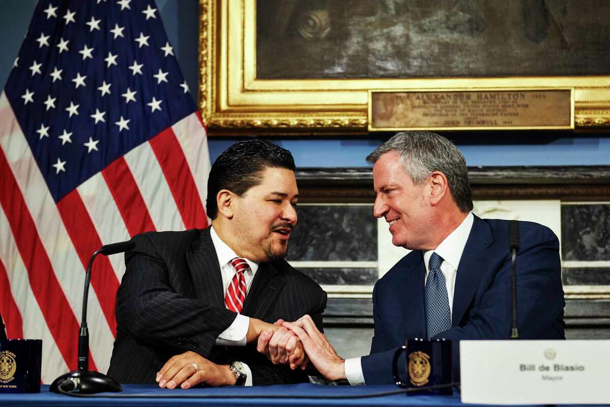 New York City Mayor Bill de Blasio, right, shakes hands with New York City Schools Chancellor Richard Carranza during a news conference at City Hall on Monday, March 5, 2018 in Manhattan, N.Y. Carranza replaces outgoing Chancellor Carmen Fariña.
