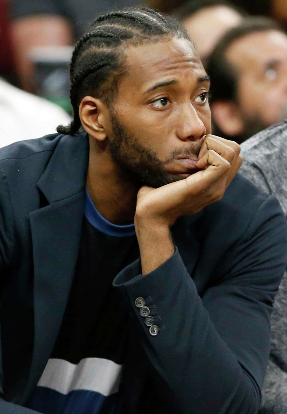San Antonio Spurs forward Kawhi Leonard (2) watches first half action against the Memphis Grizzlies from the bench Monday March 5, 2018 at the AT&T Center.