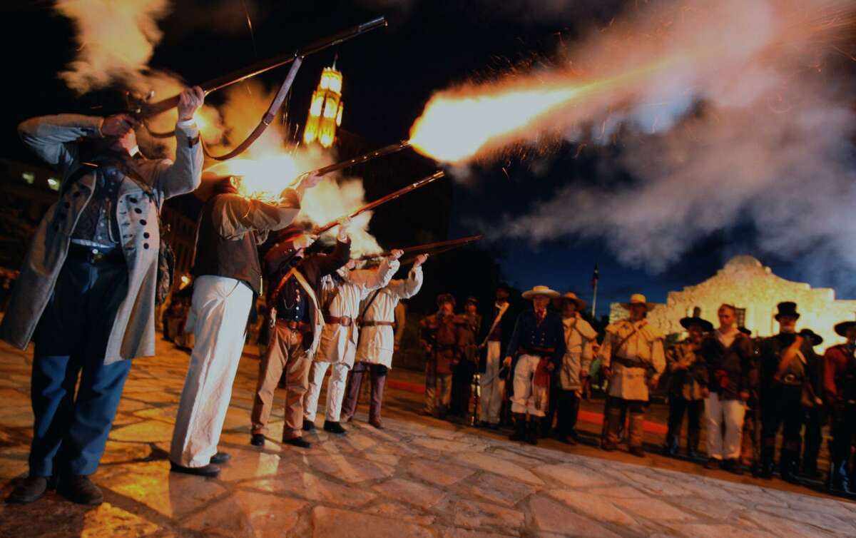 Members of the San Antonio Living History Association fire off a volley on the morning of March 6, 2007, in front of the Alamo. Re-enactors were there in period dress to mark the anniversary of the Battle of the Alamo.