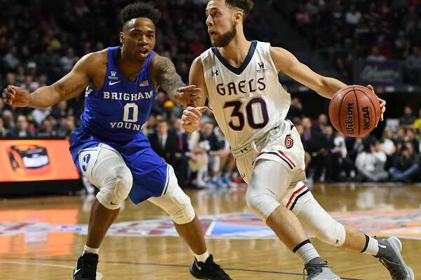 LAS VEGAS, NV - MARCH 05:  Jordan Ford #30 of the Saint Mary's Gaels drives against Jahshire Hardnett #0 of the Brigham Young Cougars during a semifinal game of the West Coast Conference basketball tournament at the Orleans Arena on March 5, 2018 in Las Vegas, Nevada.  (Photo by Ethan Miller/Getty Images)