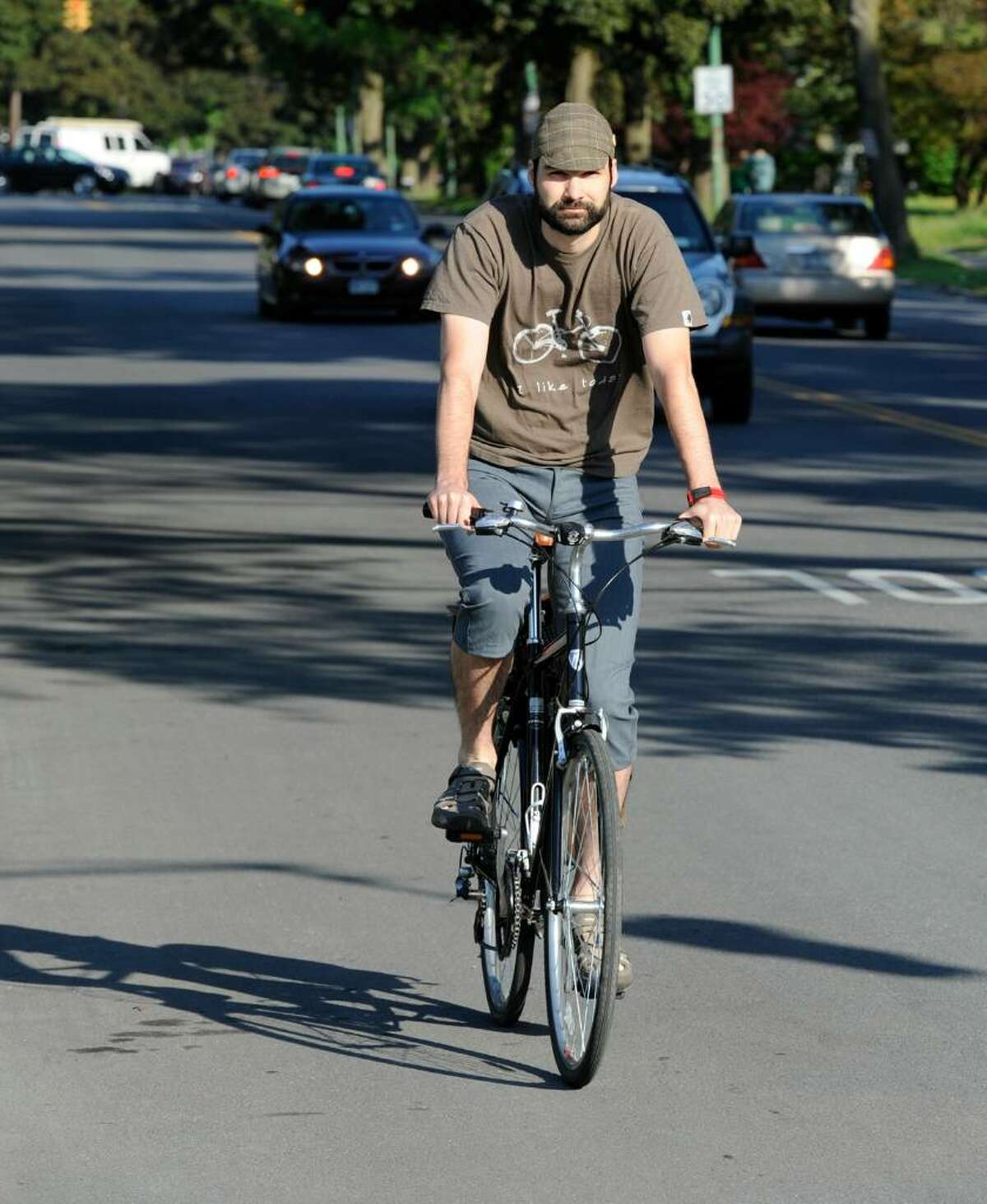 Ethan Georgi says he enjoys riding his bicycle to his Albany job. He is celebrating National Bike To Work Day. ( Skip Dickstein / Times Union)