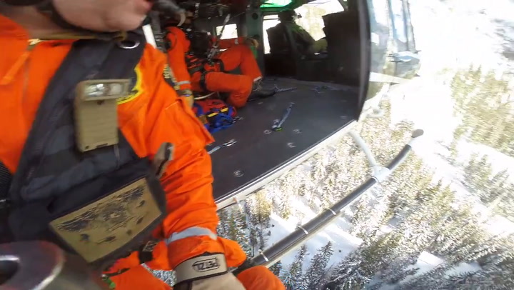 Video Helicopter Crew Rescues Man Caught In Avalanche