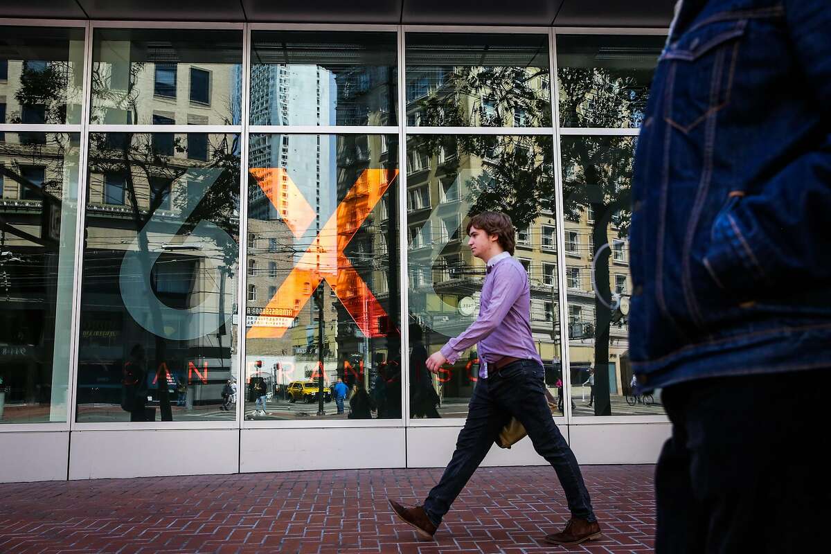 People walk past 6x6, a new empty shopping center on Market Street between Fifth and Sixth Streets in San Francisco, Calif., on Wednesday, Aug. 30, 2017.