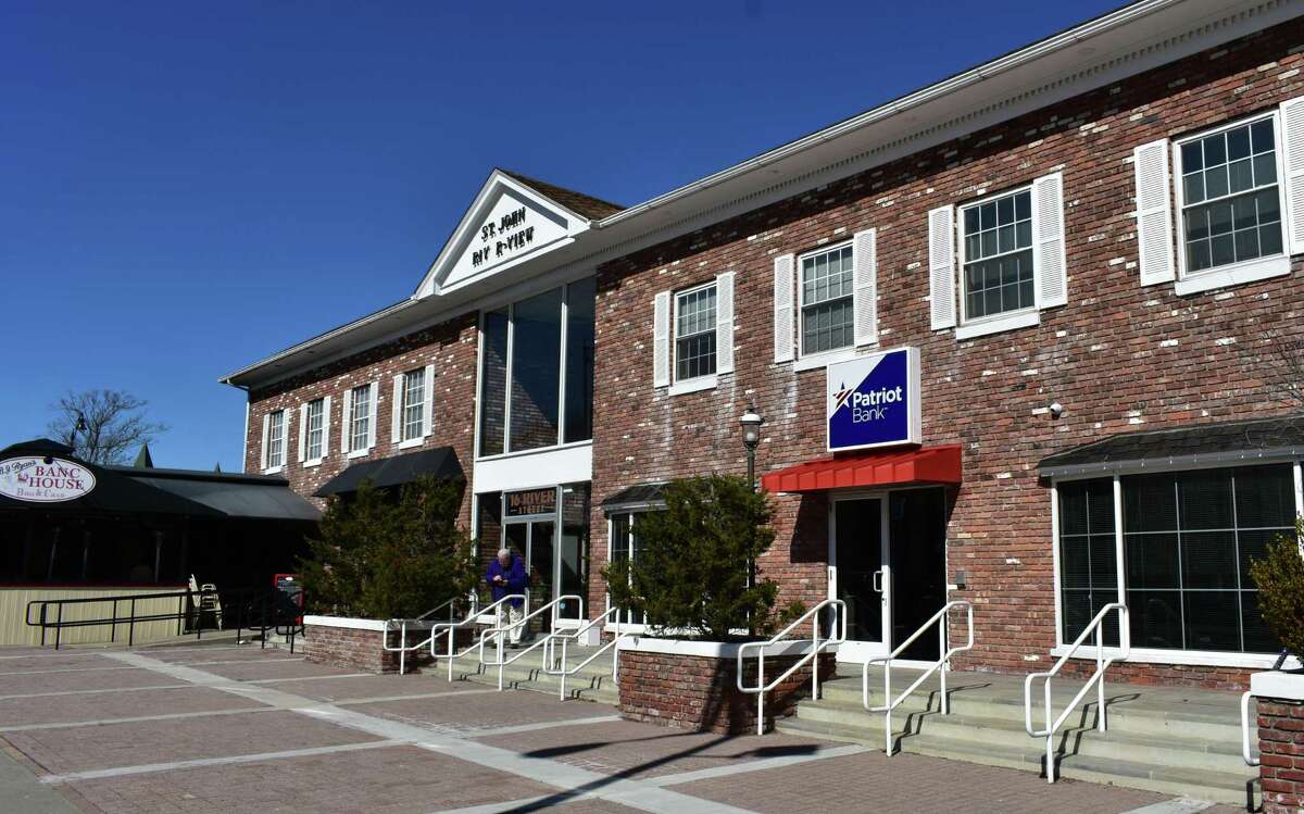 A Patriot Bank branch adjacent to B.J. Ryan's Banc House BBQ & Crab on River St. in Norwalk, around the corner from the Wall Street Theater which filed for Chapter 11 bankruptcy protection in February 2018. Patriot Bank is the Wall Street Theater's largest creditor owed $8.8 million, with restaurants in downtown Norwalk counting on the Wall Street Theater to generate additional foot traffic before and after performances.
