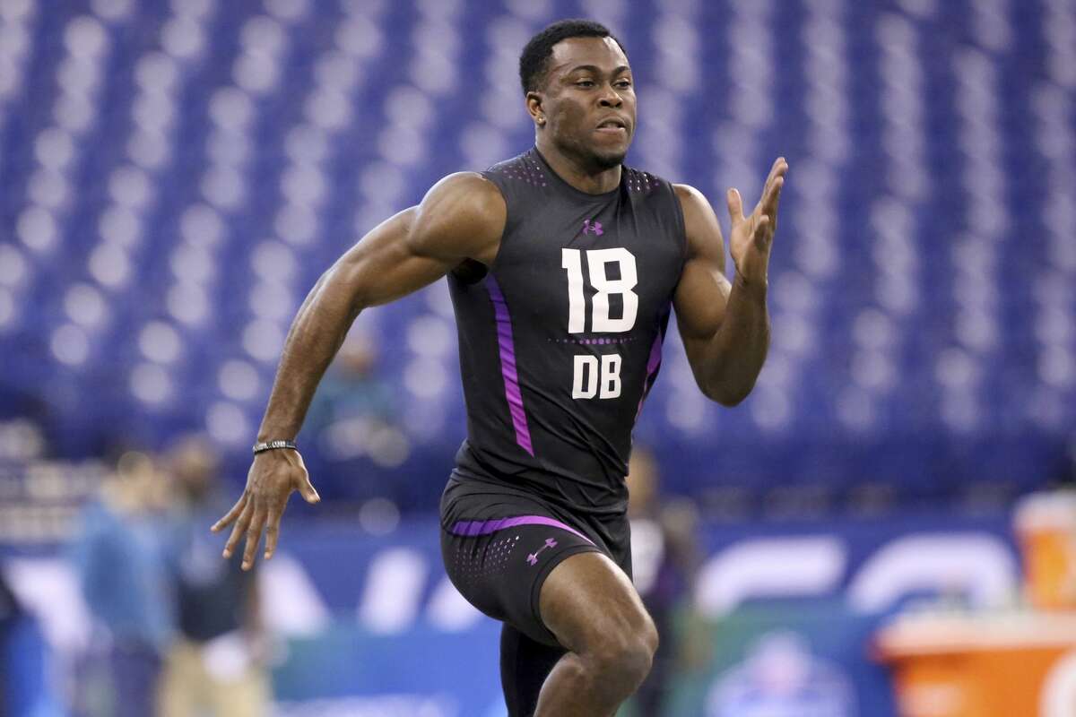 Iowa defensive back Josh Jackson runs the 40-yard dash at the 2018 NFL Scouting Combine on Monday, March 5, 2018, in Indianapolis. (AP Photo/Gregory Payan)