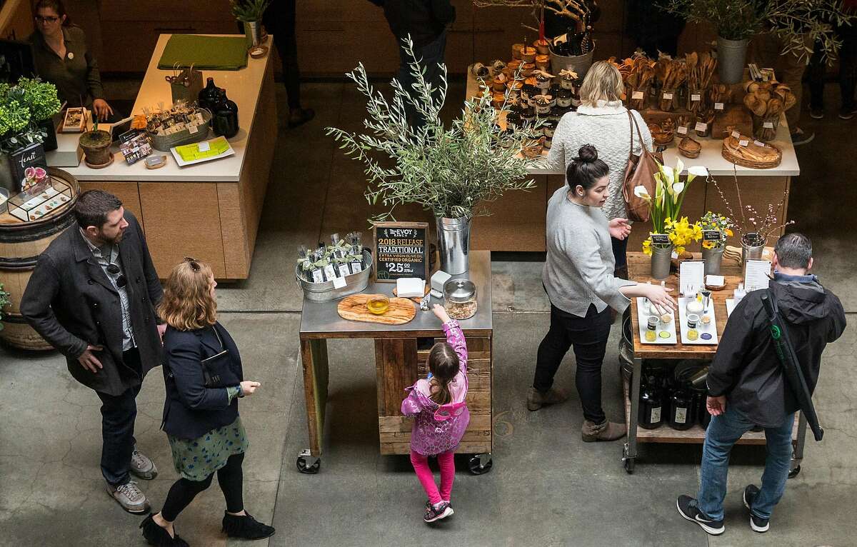 Patrons browse items at McEvoy Ranch inside the Ferry Building Saturday, March 3, 2018 in San Francisco, Calif.