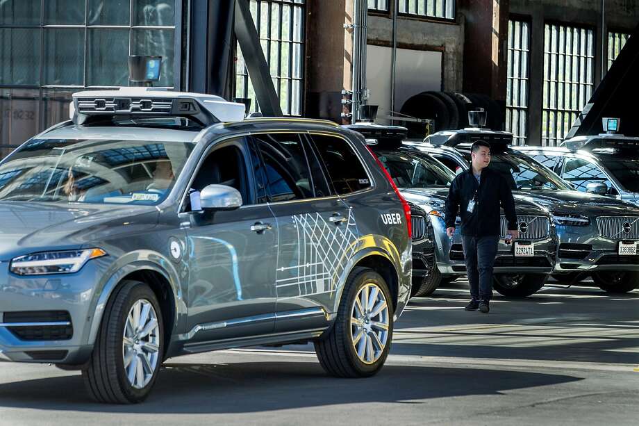 Test operator Robert Phung backs up one of Uber’s self-driving cars at the company’s facility in San Francisco. Photo: Santiago Mejia, The Chronicle