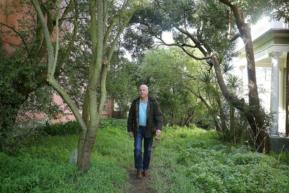 Lot owner Jason Sanders walks on his property on Monday, March 6, 2018, in San Francisco, Calif.
