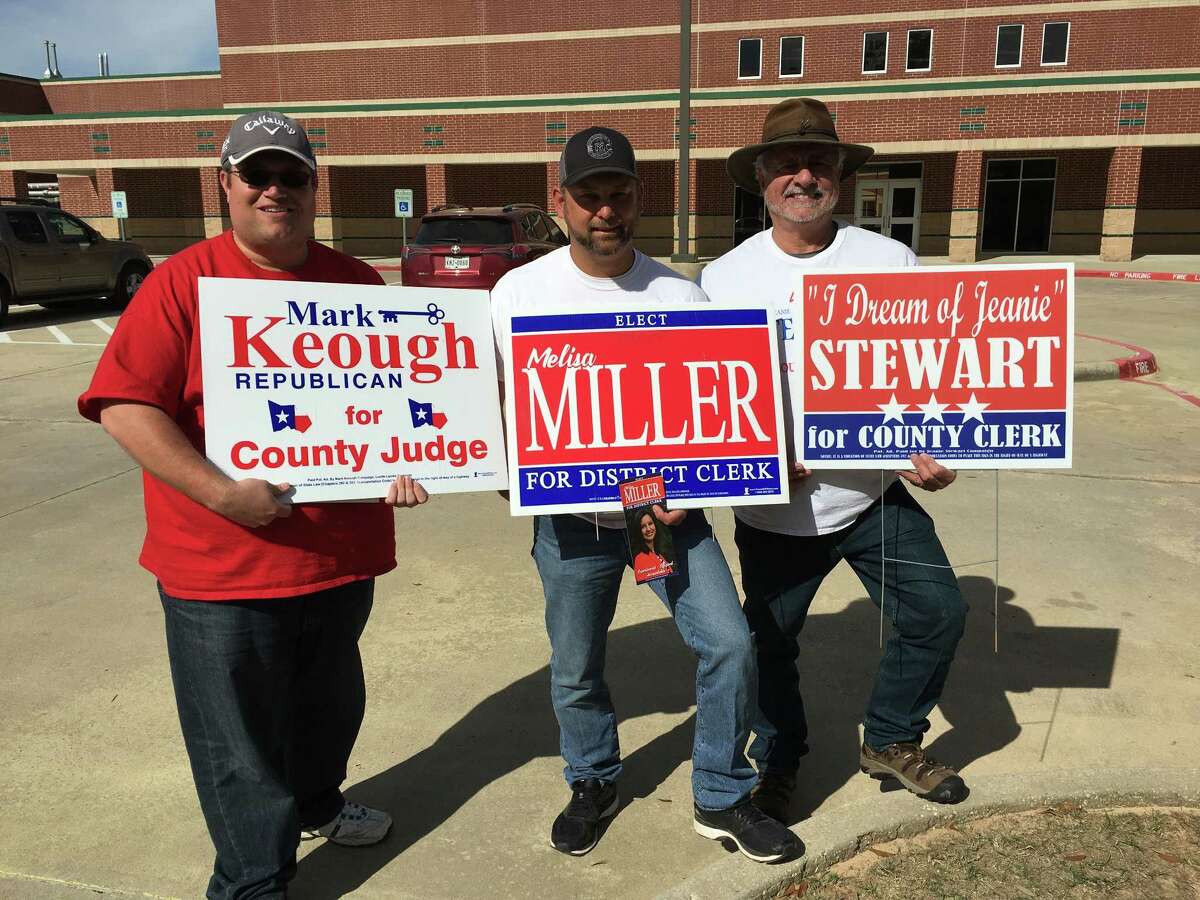 From left, Jason Millsaps, chief of staff for County Judge candidate Mark Keough, Jason Miller, husband of District Clerk candidate Melisa Miller and Bo Young, father of County Clerk candidate, Jeanie Stewart campaign at Cryar Intermediate School on Tuesday morning.