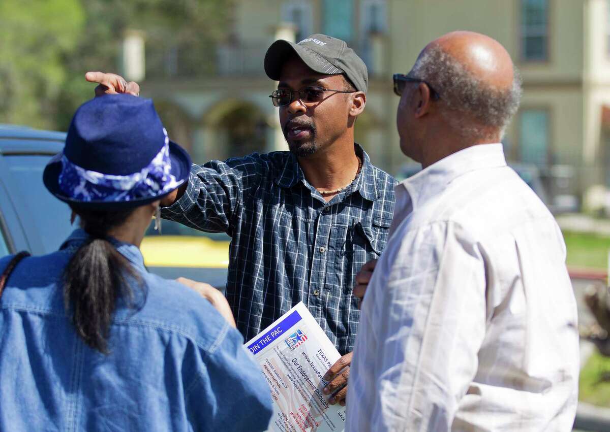 Greg Parker, candidate for Montgomery County Precinct 2 Commissioner, speaks with voters at the Cornerstone Church polling location, Tuesday, March 6, 2018, in Conroe.