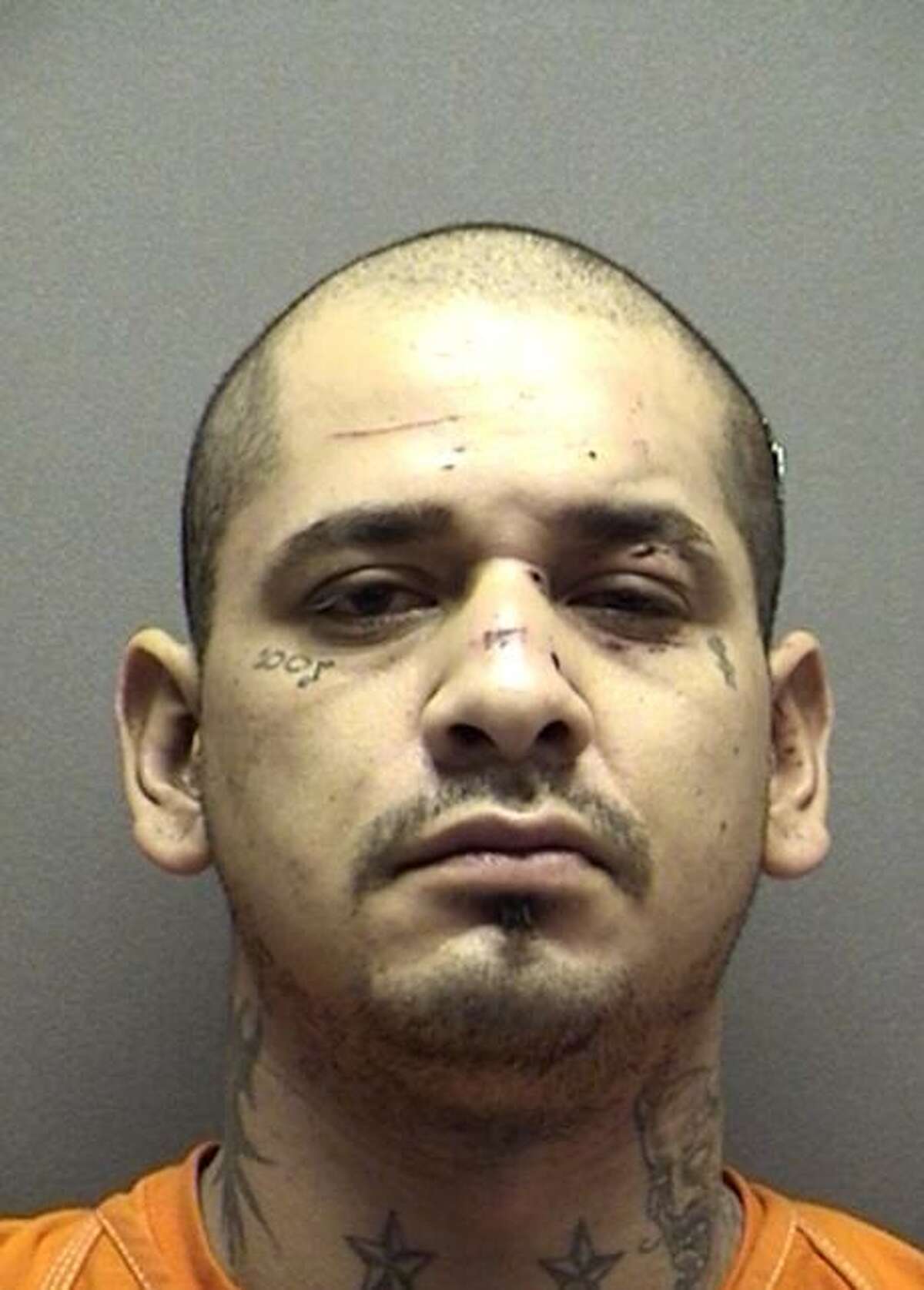 Shaun Ruiz Puente, 32, was arrested on Sunday, Dec. 8, 2013, in Wilson County following a three county chase that including the shooting of SAPD Officer Robert Deckard, 31, who was critically injured and taken to San Antonio Military Medical Center. Puente, along with Jenevieve Ramos, 28, who was also arrested in the case, are suspected in a string of robberies in San Antonio. She was charged with aggravated assault of a peace officer.