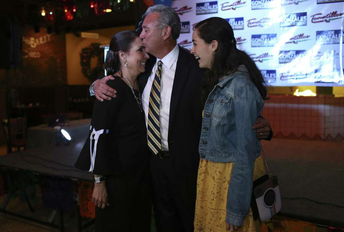 Democratic Bexar County District Attorney candidate Joe Gonzalez celebrates with his wife, Yvonne, left, and daughter, Marissa, 17, after taking a commanding lead in early voting results, Tuesday, March 6, 2018. Gonzalez looks the early voting with 61-percent over incumbent Nico LaHood who came in with 38-percent.
