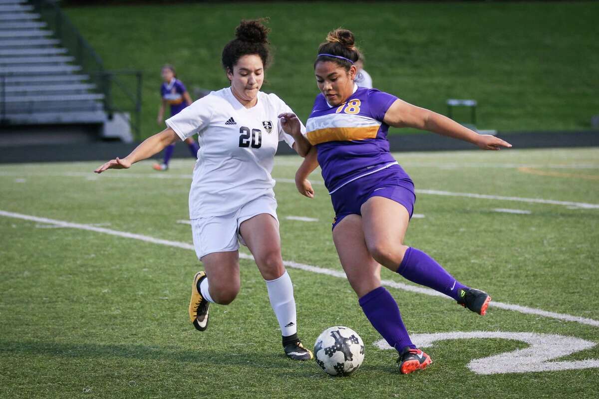 LufkinÂ?’s Rosa Flores (18) kicks the ball as ConroeÂ?’s Gabriela Morazan (20) defends during the girls soccer game on Tuesday, March 6, 2018, at Moorhead Stadium in Conroe. (Michael Minasi / Houston Chronicle)