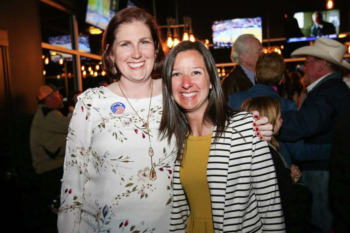 Melanie Bush, for Montgomery County treasurer, left, celebrates with Melisa Miller, for Montgomery County district clerk, on Tuesday, March 6, 2018, at Woodson's.