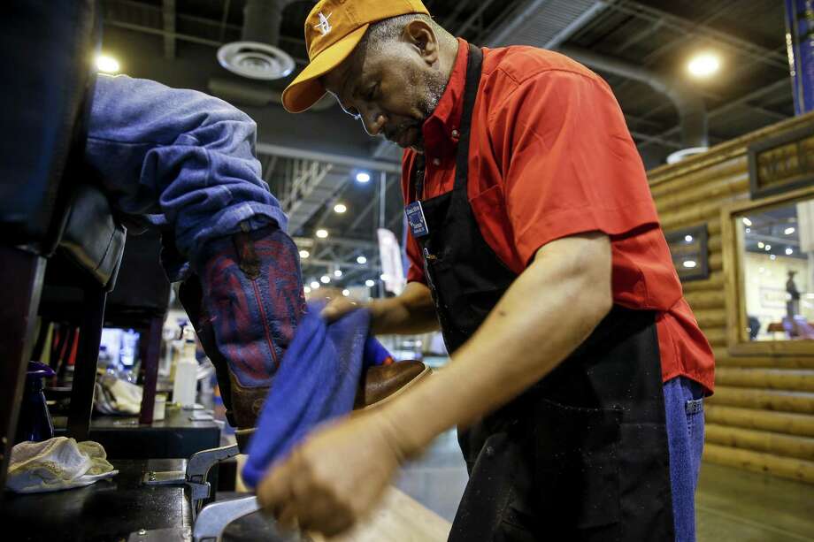 Houston rodeo a boon for shoe shiners polishing cowboy boots ... Classic Shoe Shine Company leather technician Norman Hardy, right, shines Cole Robertson's boots at