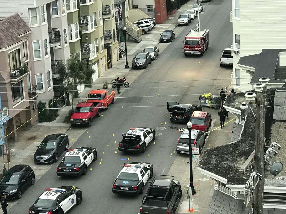 Dozens of evidence markers; shell casings visible in this overhead view of San Francisco Police Officer-involved shooting by KTVU's Allie Rasmus. Police say shooting occurred while they tried to detain robbery suspect hiding in trunk of a car on 22nd and Capp Streets in San Francisco.