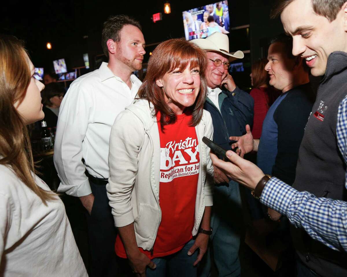 Kristin Bays, for 284th District Court judge, celebrates on Tuesday, March 6, 2018, at Woodson's.