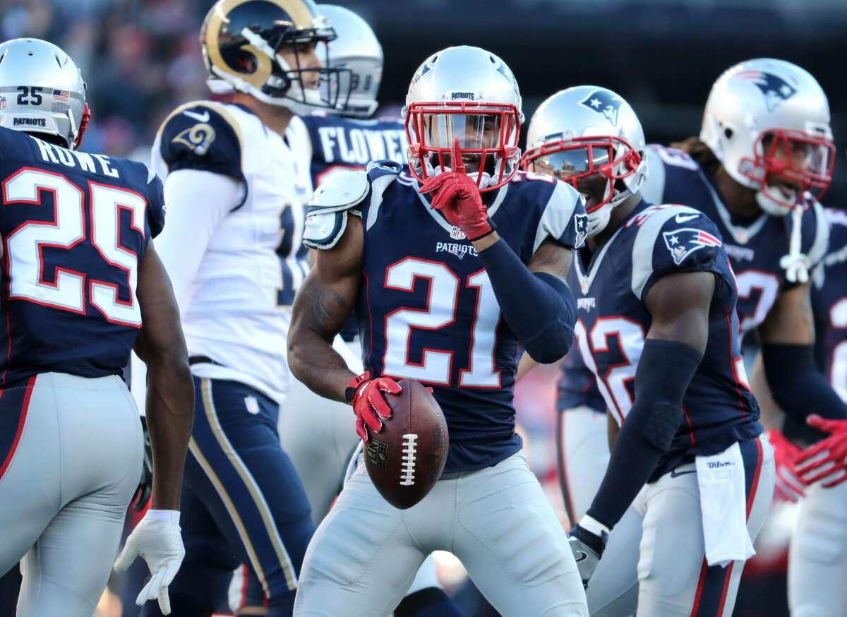 FOXBOROUGH, MA - DECEMBER 4: New England Patriot Malcolm Butler gestures after an interception during the first quarter. The New England Patriots host the Los Angeles Rams in a regular season NFL football game at Gillette Stadium in Foxborough, MA on Dec. 4, 2016. (Photo by Matthew J. Lee/The Boston Globe via Getty Images)