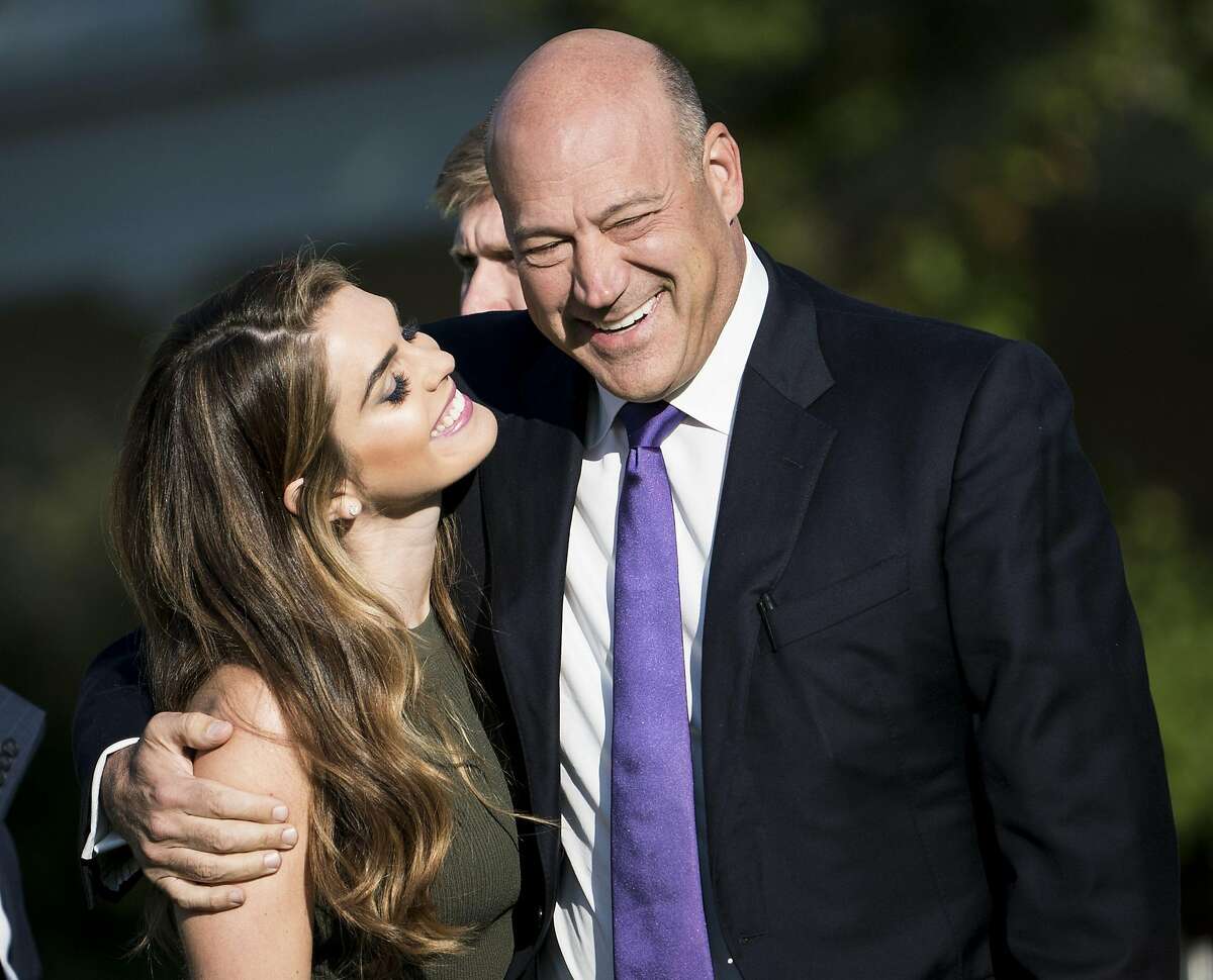 (FILES) In this file photo taken on September 11, 2017 White House Communications Director Hope Hicks and National Economic Council Director Gary Cohn arrive on the South Lawn of the White House in Washington, DC, for a memorial service for the 9/11 terrorist attacks. Donald Trump's White House was rocked by another high-profile resignation March 6, 2018, as top economic advisor Gary Cohn quit in protest at the president's decision to levy global steel tariffs. "It has been an honor to serve my country and enact pro-growth economic policies to benefit the American people," Cohn said in a terse statement that belied fierce infighting in Trump's tumultuous White House. / AFP PHOTO / Brendan SmialowskiBRENDAN SMIALOWSKI/AFP/Getty Images