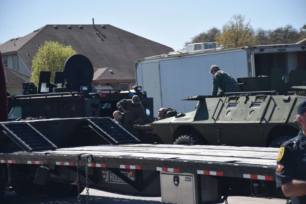 DPS troopers set up equipment at the scene of an hours-long standoff on Wednesday, March 7, 2018 in the 9200 block of Saddle Trail.
