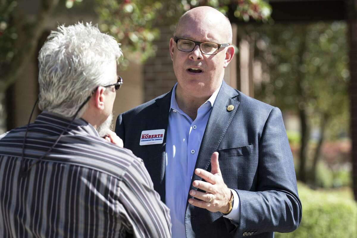 Kevin Roberts, a Republican running for the 2nd Congressional District, talks to voters outside the polling place at Resurrection Lutheran Church on March 6, 2018, in Houston. ( Brett Coomer / Houston Chronicle )