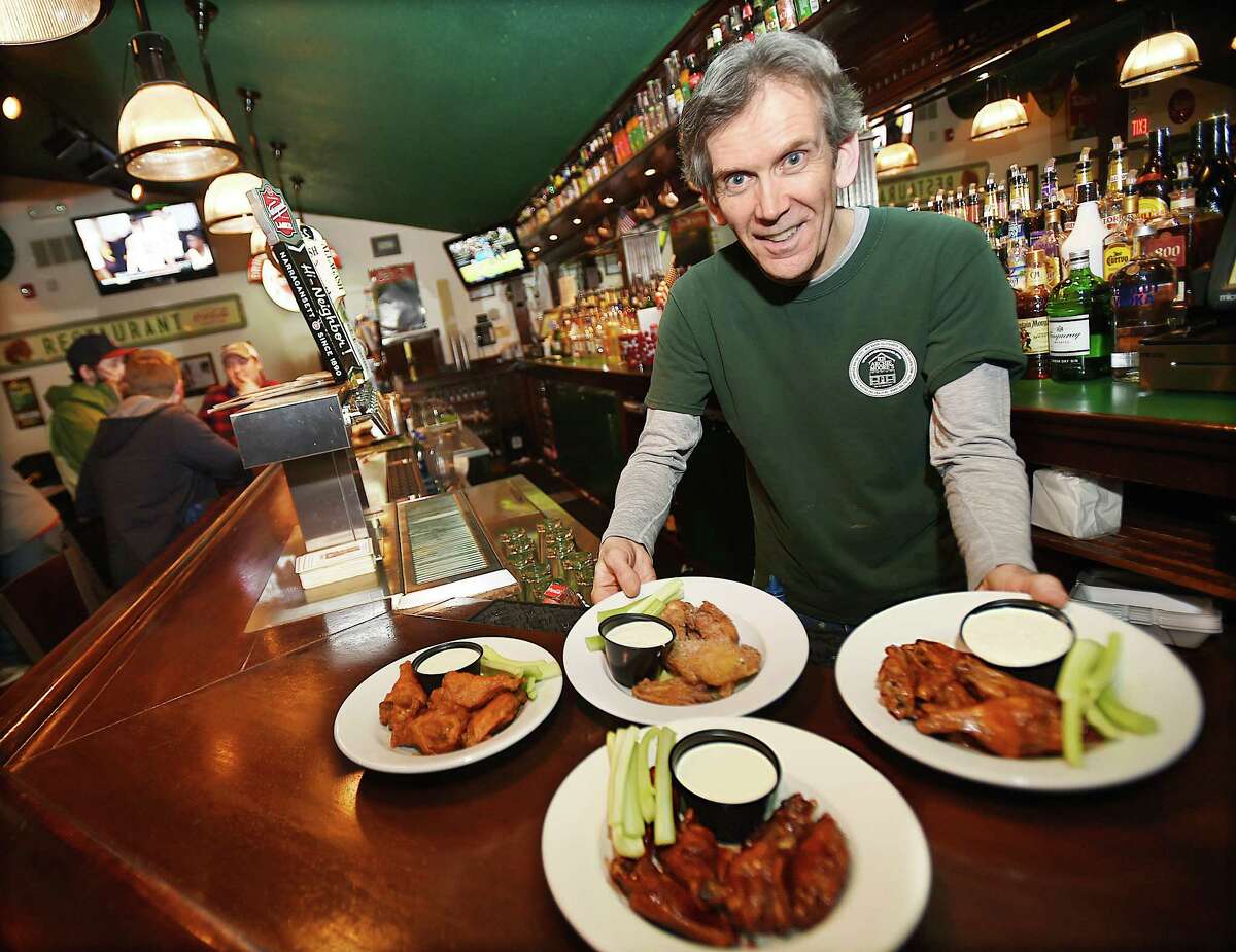 Kevin Canel displays a sample of buffalo, garlic parmesan, chipotle and raspberry bourbon wings at Archie Moore's Bar & Restaurant at 15 Factory Lane in Milford. Archie Moore's (locations in Fairfield, Milford, New Haven and Wallingford): Best chicken wings finalist No... not the boxer. Archie Moore's was established by an Irish immigrant who ran a watering hole back in 1898 and decades later, graduated to serving liquor and wings. The buffalo wings sauce has become well-known around Connecticut as a favorite and is even sold by the bottle.  archiemoores.com
