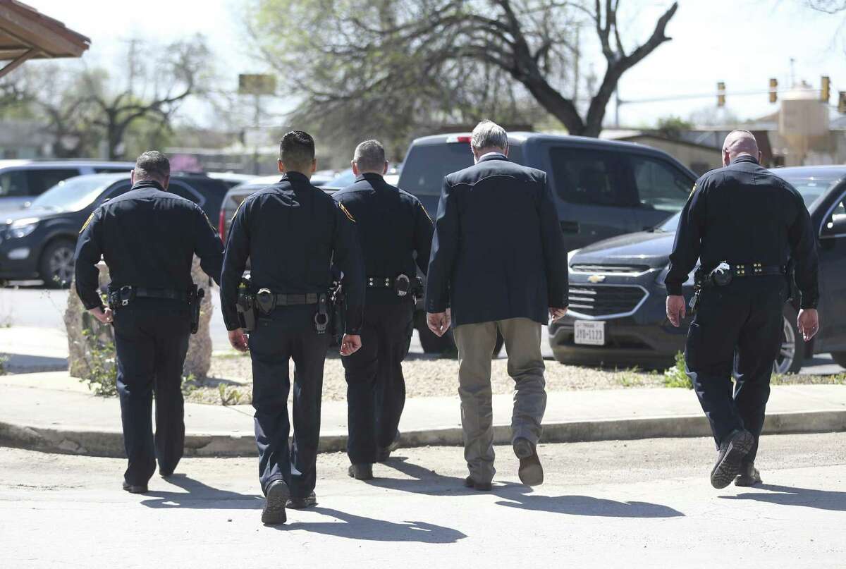 San Antonio Police Department officers leave the Atascosa County Courthouse last month during a lunch break in the capital murder trial of Shaun Ruiz Puente, 36, who was later convicted of killing SAPD officer Robert Deckard in 2013.