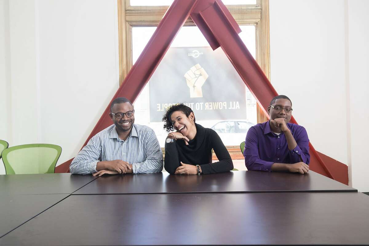 Jimmy Donelson III, Victoria Paykar and Denzel Tongue of The Greenlining Academy's leadership development program that develops multi-ethnic leaders who will advance racial and economic equity, in their offices on Tuesday, March 6, 2018 in Oakland, Calif.