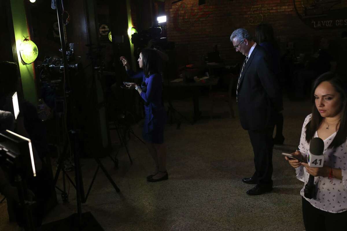 Democratic nominee for Bexar County District Attorney Joe Gonzales, center, waits for television interviews after winning the primary race against incumbent Nico LaHood, Tuesday, March 6, 2018. Gonzales will face Republican Tylden Shaeffer in the November general elections.