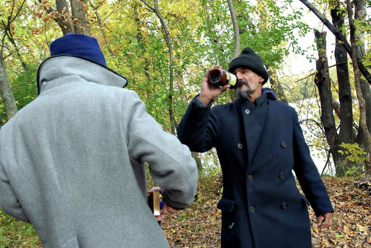Samuel "Poppy" Baez, right, drinks a beer while hanging out in the woods with his friend Andrew on Wednesday, Oct. 14, 2009, at the Corning Preserve in Albany, N.Y. (Cindy Schultz / Times Union)