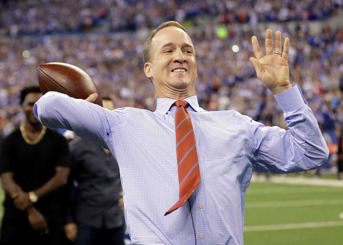 FILE - In this Oct. 8, 2017, file photo, former Indianapolis Colts quarterback Peyton Manning throws a pass during a halftime ceremony at an NFL football game between the Colts and the San Francisco 49ers in Indianapolis. The Colts retired Manning's jersey during the ceremony. Manning sold his share in 31 Denver-area Papa John's stores last week, two days before the NFL dropped the chain as its official pizza sponsor. The Denver Post reported Wednesday, March 7, that Papa John's spokesman Peter Collins confirmed the former NFL quarterback sold his stake to an existing Papa John's franchisee. (AP Photo/Darron Cummings. File)