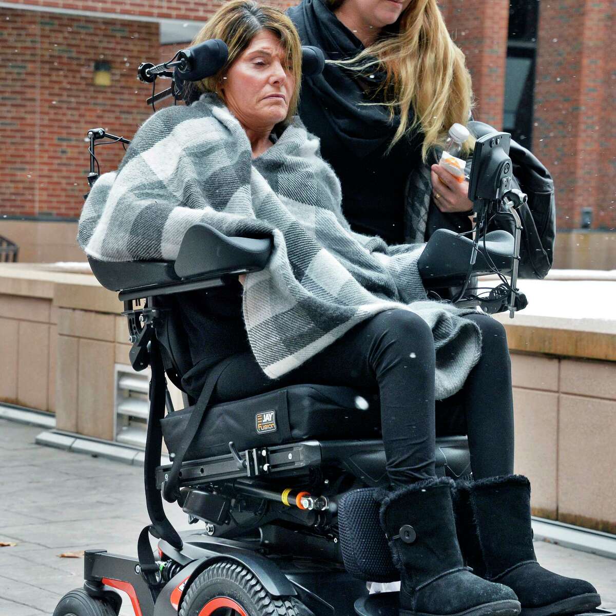 Deann Shapiro, 50, of Cohoes, a victim of car crash who is now a quadriplegic, leaves Saratoga County Court Thursday March 8, 2018 in Ballston Spa, NY. (John Carl D'Annibale/Times Union)