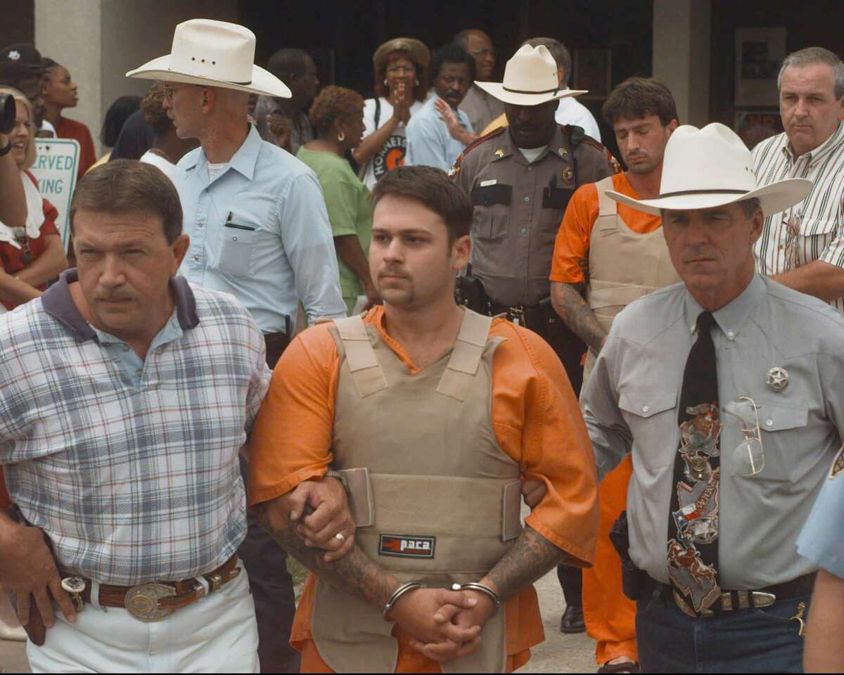 John William King, front, and Lawrence Russell Brewer are escorted from the Jasper County Jail Tuesday, June 9, 1998, in Jasper, Texas. King, Brewer and Shawn Allen Berry are charged with first degree murder in the death of James Byrd Jr. Byrd Jr. was tied to a truck and dragged to his death along a rural East Texas road. (AP Photo/David J. Phillip)
