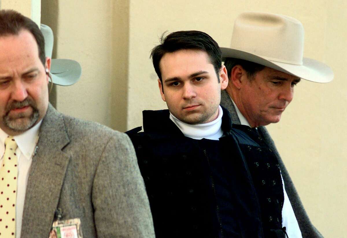 Convicted killer John William King, center, is escorted from the Jasper County Courthouse after being found guilty of capital murder in the dragging death of James Byrd Jr. Tuesday, Feb. 23, 1999, in Jasper, Texas. King is asking the state to drop the automatic appeal of his death sentence and also wants to withdraw his response to a wrongful death lawsuit filed by the children of James Byrd Jr. (AP Photo/David J. Phillip)