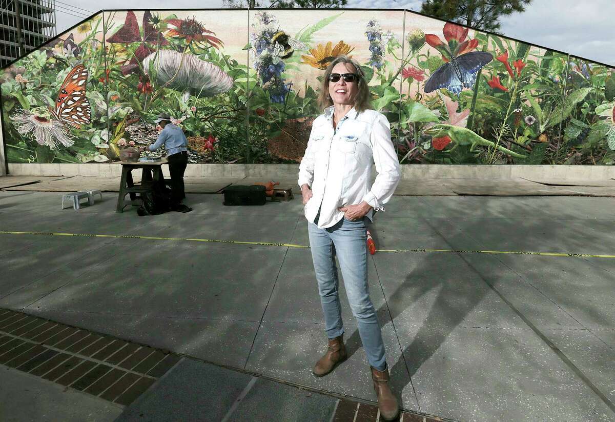 Muralist Dixie Friend Gay and the mural she is completing at the new Midtown Park on Friday, March 2, 2018, in Houston. ( Elizabeth Conley / Houston Chronicle )