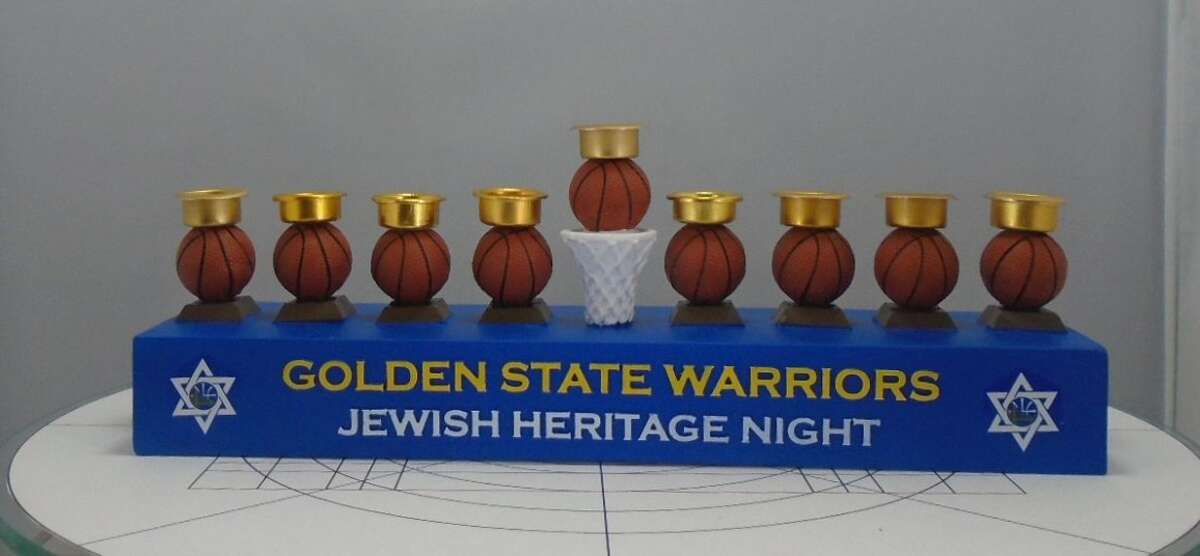 Nearly 2,000 Golden State Warriors menorahs are being recalled because their basketball-shaped candleholders pose a fire risk.
