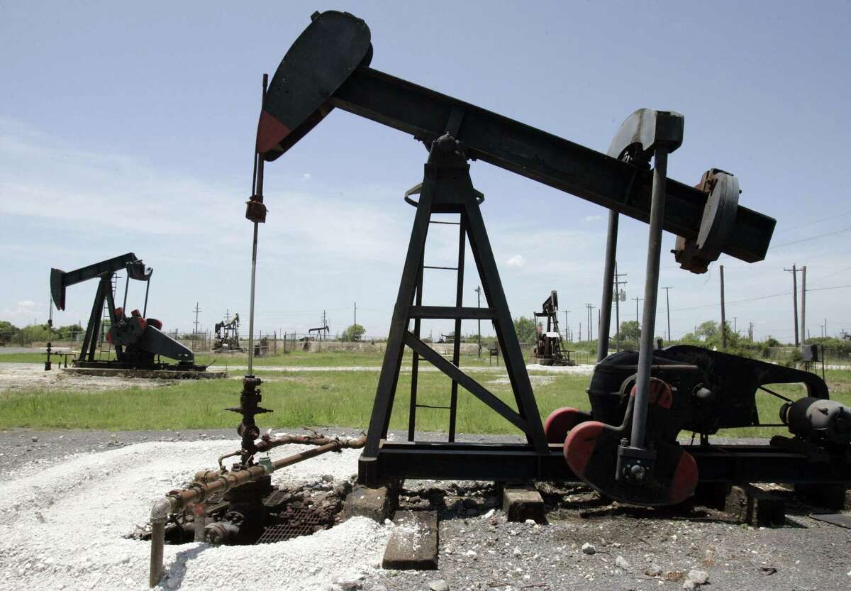Oil pump jacks work in a field near the Houston Ship Channel in Baytown in 2008.