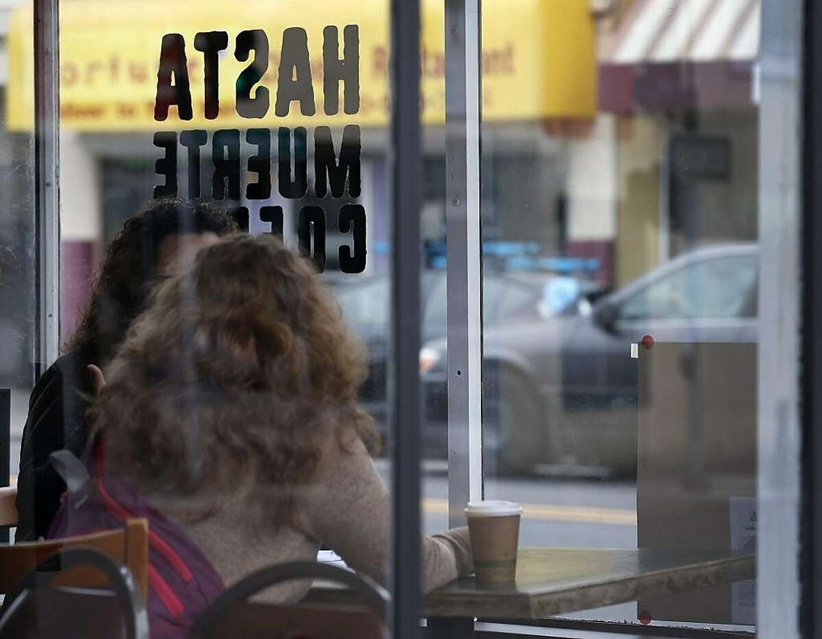 Customers sit inside Hasta Muerte Coffee in Oakland, Calif. on Friday, March 9, 2018. Owners of the cafe on Fruitvale Avenue are refusing service to uniformed police officers.