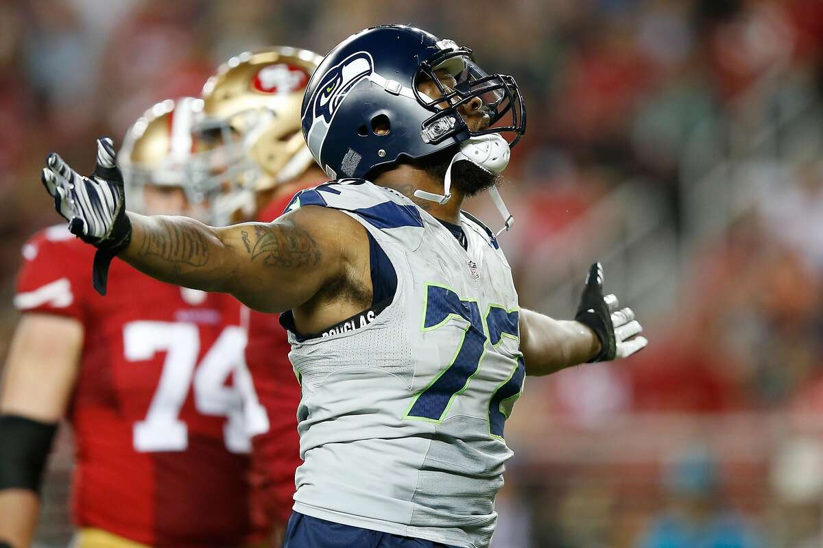 SANTA CLARA, CA - OCTOBER 22: Michael Bennett #72 of the Seattle Seahawks celebrates after a sack of Colin Kaepernick #7 of the San Francisco 49ers during their NFL game at Levi's Stadium on October 22, 2015 in Santa Clara, California. (Photo by Ezra Shaw/Getty Images) *** BESTPIX ***