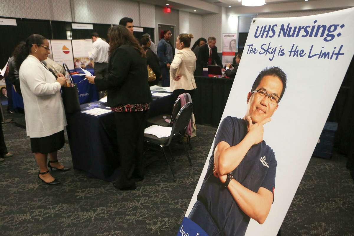 University Health System recruiters talk to jobseekers at the Mega Career Fair in 2018. The county-owned hospital system has nearly doubled its workforce in the past decade.