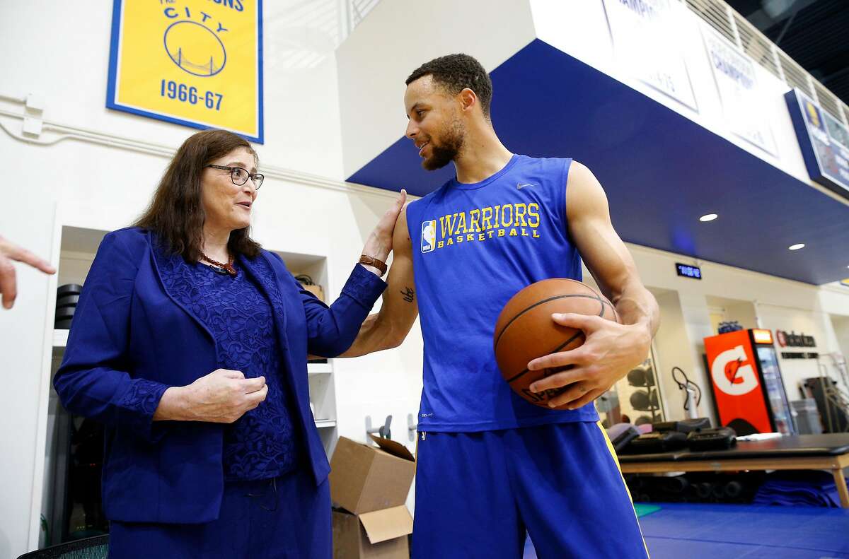 Denise Long visits with Stephen Curry during a recent Golden State Warriors' practice session. Long, after graduating from High School was drafted by the Golden State Warriors to play on their women's exhibition team. She got the chance to visit with players and see a Golden State Warriors' practice, on Thurs. March 8, 2018, in Oakland, Calif.