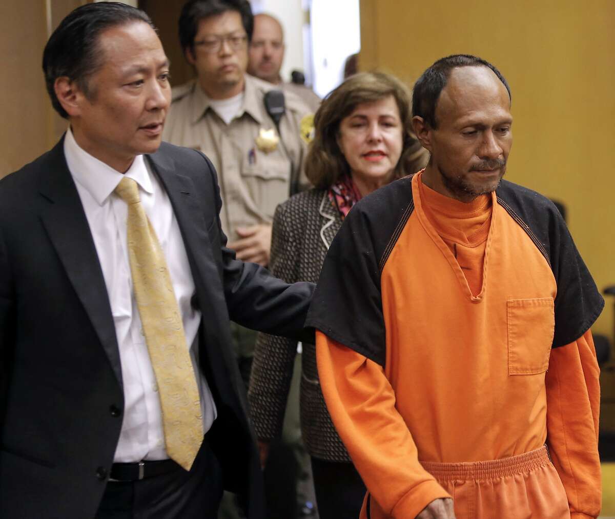San Francisco Public Defender Jeff Adachi, (left) leads Juan Francisco Lopez-Sanchez, into the Hall of Justice in San Francisco, Calif. on Tues. July 7, 2015, for his arraignment on suspicion of murder in the shooting death of Kate Steinle on San Francisco's Pier 14 last Wednesday.