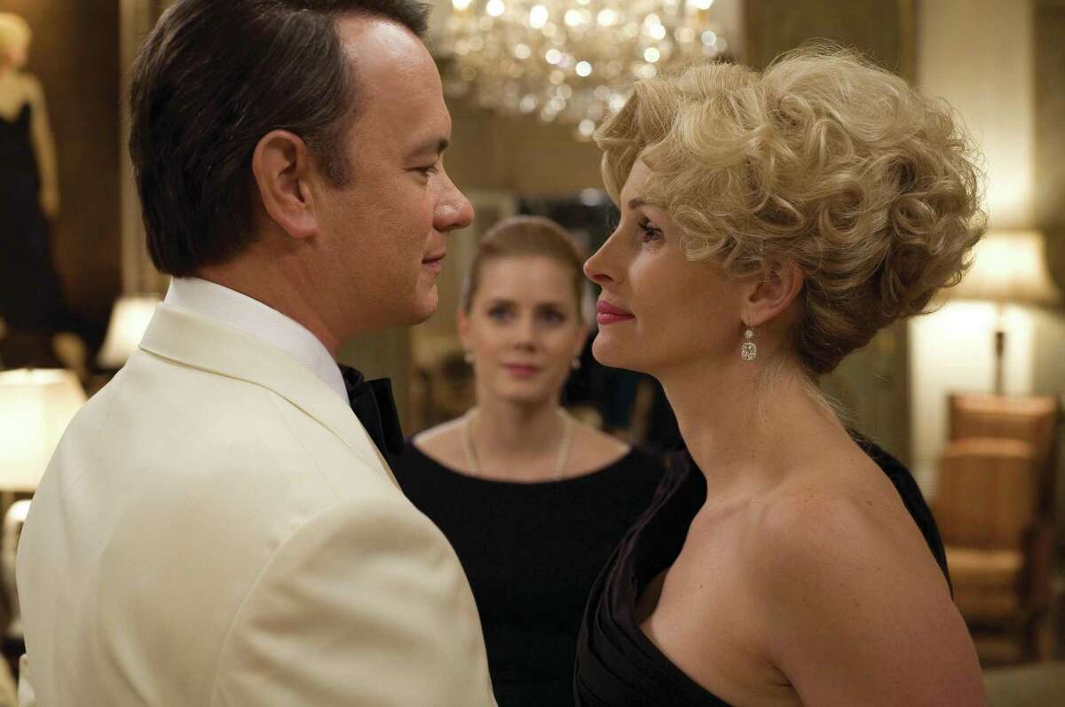 Tom Hanks plays Congressman Charlie Wilson and Julie Roberts portrays Houstonian Joanne Herring in the 2007 film, “Charlie Wilson’s War,” the raucous true story of the largest covert operation in history. Amy Adams (middle) plays Herring’s assistant.
